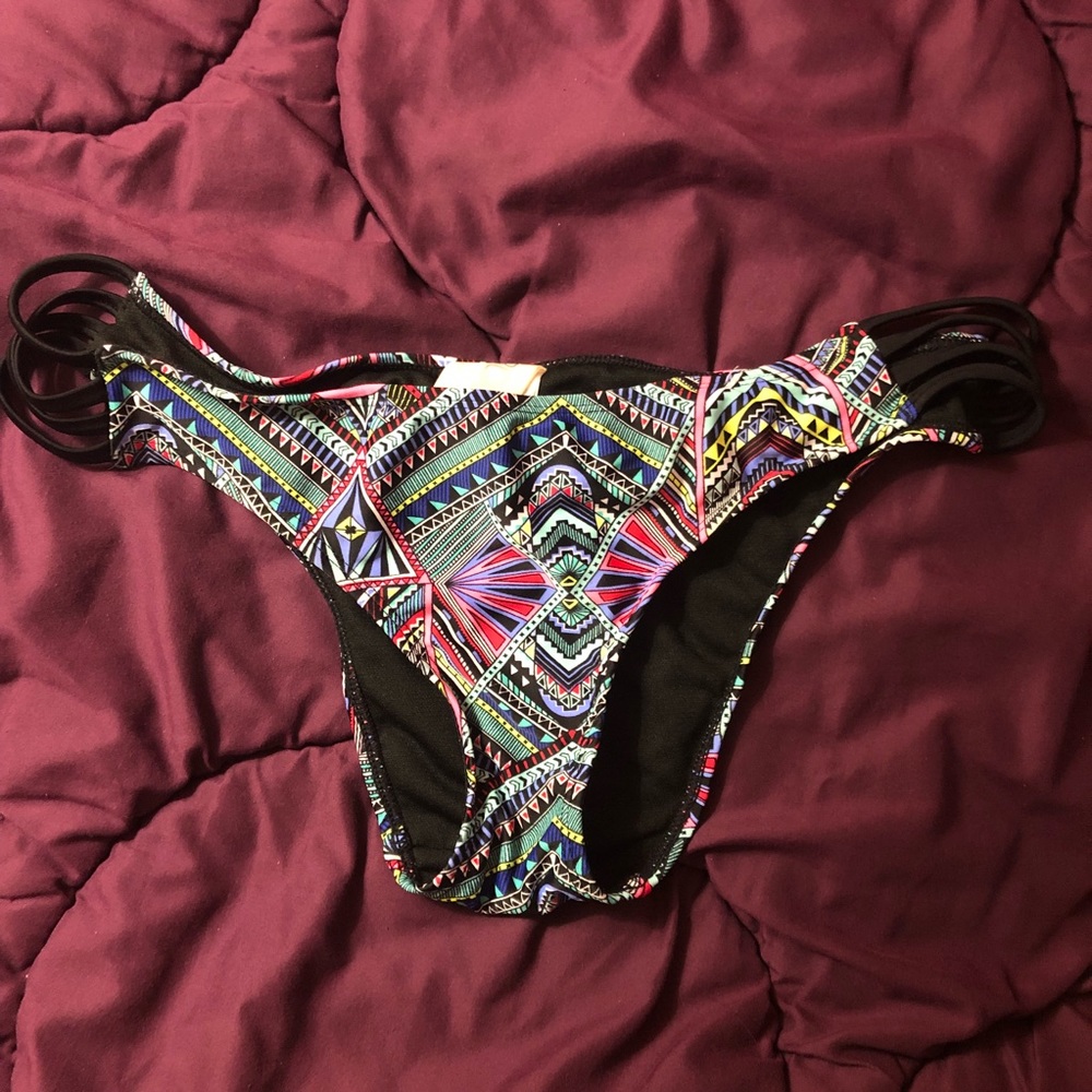 Multi-colored swim bottoms with side cutouts